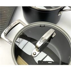 Three Le Creuset pans suitable for induction hobs inc. griddle pan, 20cm & 18cm pans with glass lids