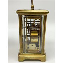 Early 20th century brass and bevel glazed carriage alarm clock, white enamel Roman dial with alarm set dial, single train movement, with red leather case 