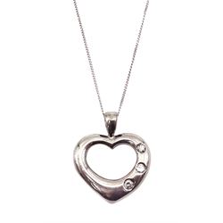 18ct white gold heart pendant, set with three round brilliant cut diamonds, hallmarked, on a 9ct white gold chain, stamped 375