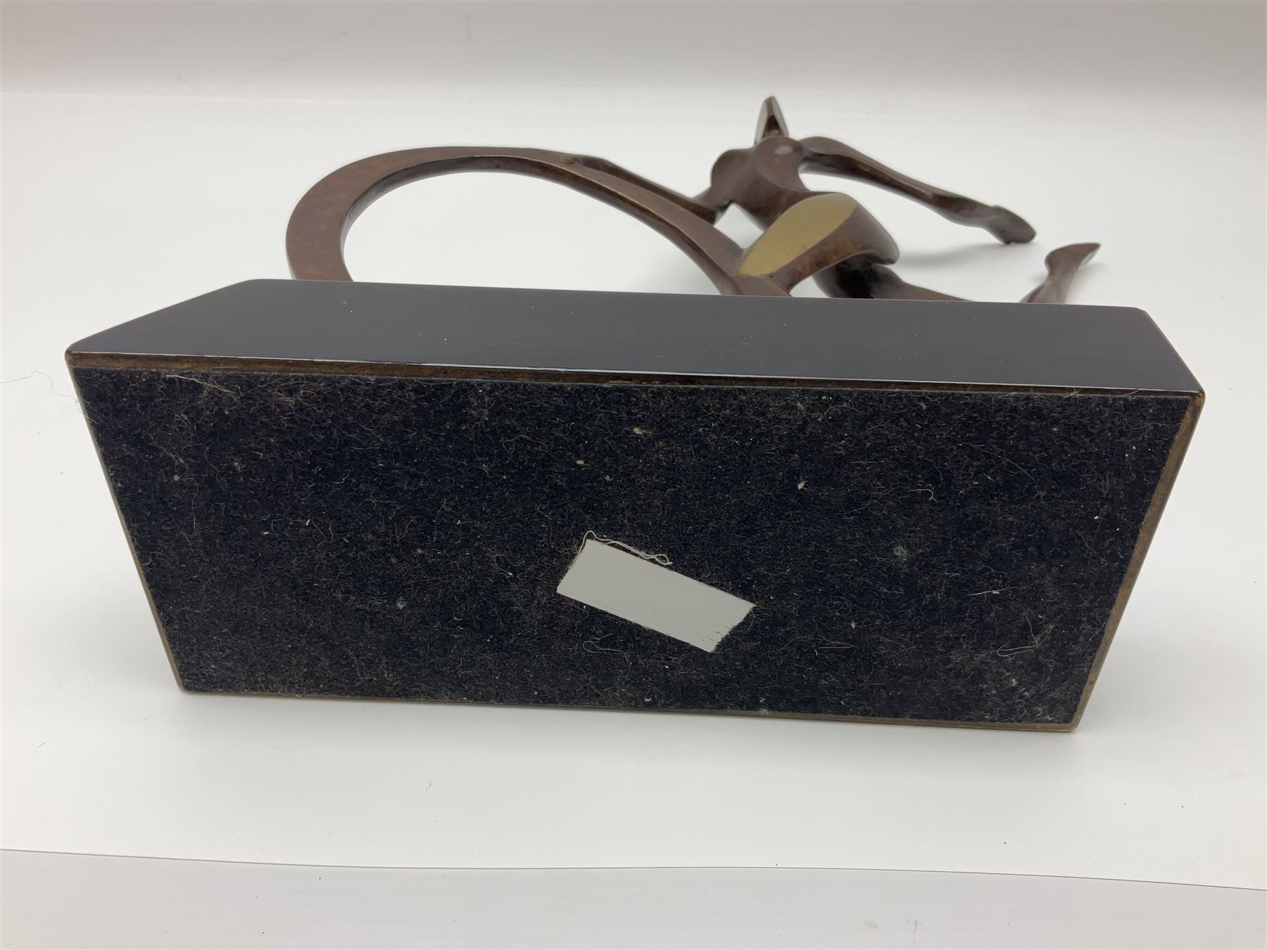 John Huggins FRBS (British 1938): 'Girl with Hoop', bronze sculpture upon black lacquered wooden base, H33cm, artist resale rights apply