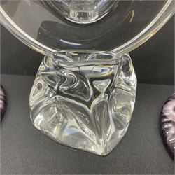 Daum glass two stemmed candle stick signed to verso, together with a pair of slag glass purple candle sticks, Daum H21cm