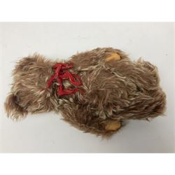 Steiff teddy bear with golden plush body, revolving head, applied eyes, vertically stitched nose and mouth and jointed limbs; button to left ear H26cm; and two other Steiff teddy bears, each with open mouth and button with tag to left ear (3)

