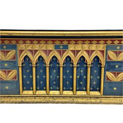 In the manner of William Burges - mid-to-late 19th century English Gothic Revival pine altar or console table, in blue and red paint with water gilding, the moulded rectangular top over six pointed arches with turned column supports, the front carved with a single row of lozenges and incised stylised motifs