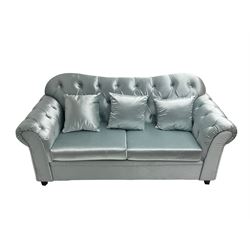 Chesterfield shaped two seat sofa, upholstered in buttoned light blue fabric, with scatter cushions