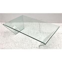 Contemporary glass coffee table, rectangular top with polished edge, on shaped end supports