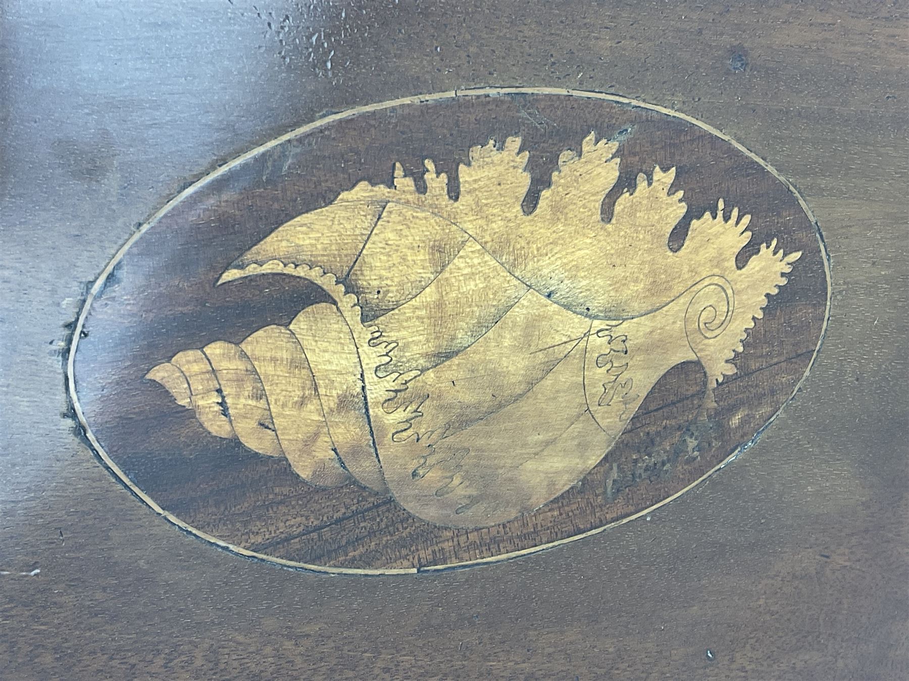 George III mahogany bureau, the conch inlaid fall front enclosing pigeon holes, shelves and central cupboard with inlaid flower motif, four graduating cock-beaded drawers below each with brass handles, lower moulded edge over shaped bracket feet