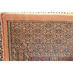  Persian Bokhara blue ground rug, 250cm x 150cm  