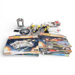 Quantity of loose Lego from various kits, together with a collection of Lego instruction b...