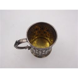 Victorian silver christening mug, with repousse and chased scroll and bead decoration, lozenge shaped cartouche engraved with monogrammed initials and acanthus capped C scroll handle, hallmarked Robert Hennell III, London 1861, H9.3cm