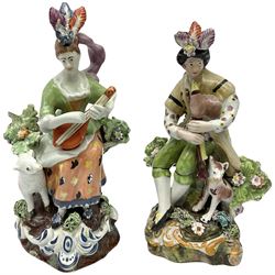 Two 19th century Staffordshire pottery figures, circa 1825, modelled after original models by Derby, the first example modelled as a shepherd bagpiper, the second as a shepherdess playing the lute, H16cm
