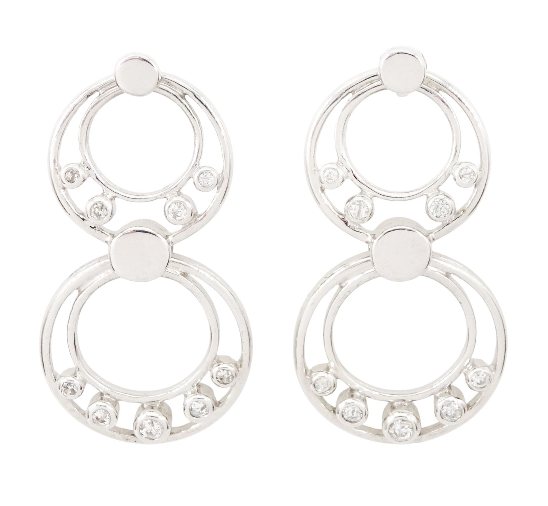 Pair of 9ct white gold diamond pendant earrings, each stud with two circular drops, set with nine round brilliant cut diamonds