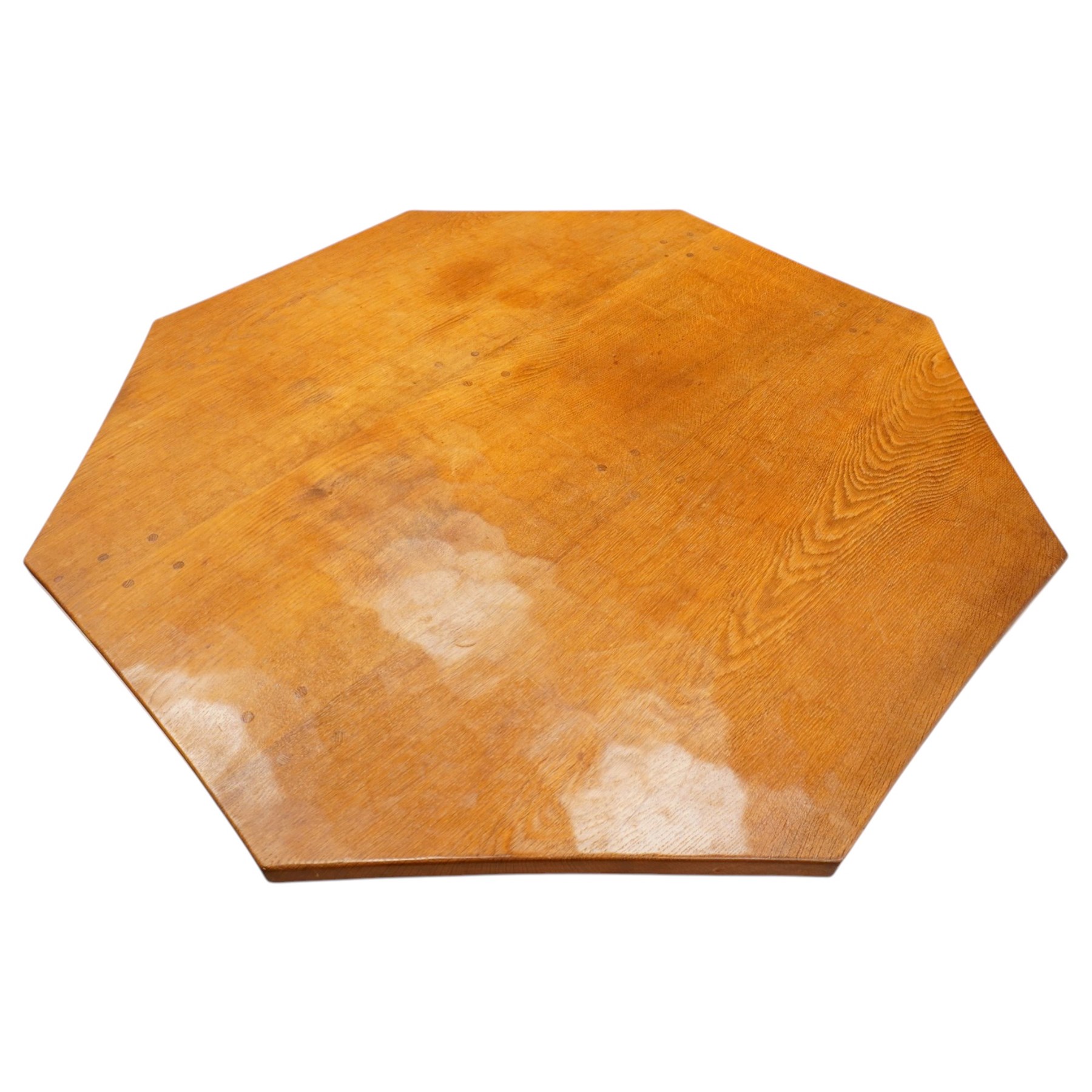 Mouseman - 1940s pre-war adzed oak octagonal dining table, the octagonal adzed top with concave sides, raised on a cruciform base with sledge feet, with carved mouse signature, by the workshop of Robert Thompson of Kilburn

Provenance: ordered directly from the Mouseman workshop in the 1940s before the outbreak of the war, the items were subsequently delivered after the end of war. 