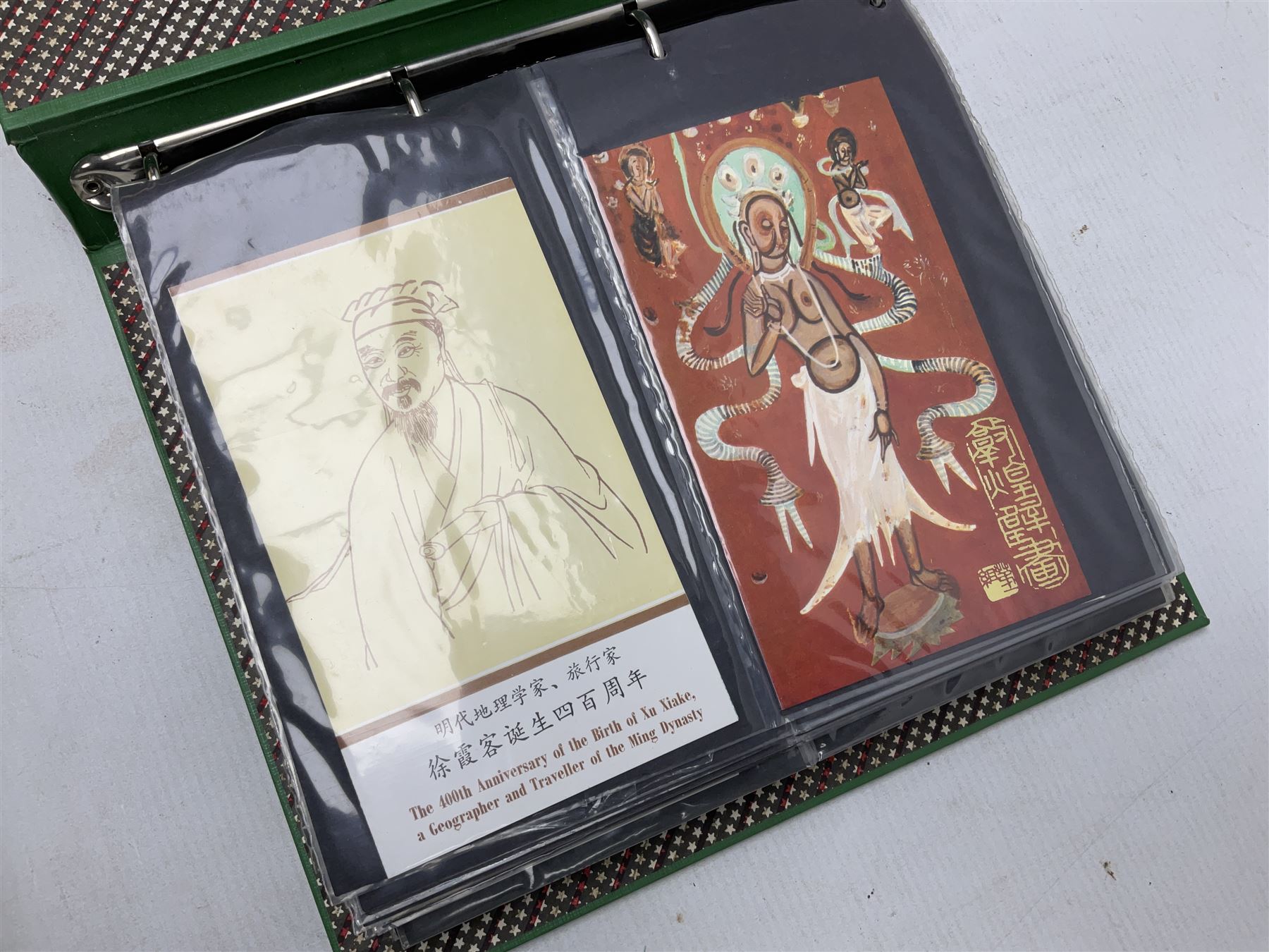 Mostly Chinese stamps including  covers and postcards, many being from the 80s and 90s, housed in ten folders