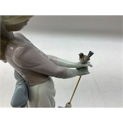 Two Lladro figures, comprising Garden Classic, no 7617 and Garden Song, no 7618, with original boxes and artists signature beneath, largest example H23cm