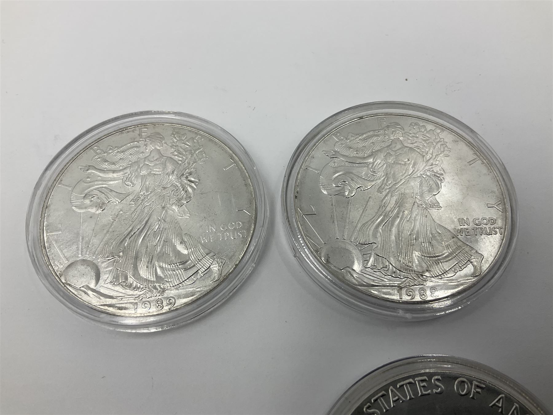 Five United States of America 1oz fine silver one dollar coins, dated 1986, 1987, 1988, 1989 and 1990