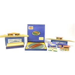 Hornby Dublo - six D1 accessories comprising Turntable; Through Station with separately boxed Platform Extension with Wall; Signal Cabin with orange roof and two packs of station names; Level Crossing; and Island Platform; all boxed (6)