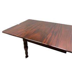 19th century mahogany extending dining table with three additional leaves, rectangular top with rounded corners, pull-out action, on turned and faceted supports with brass castors