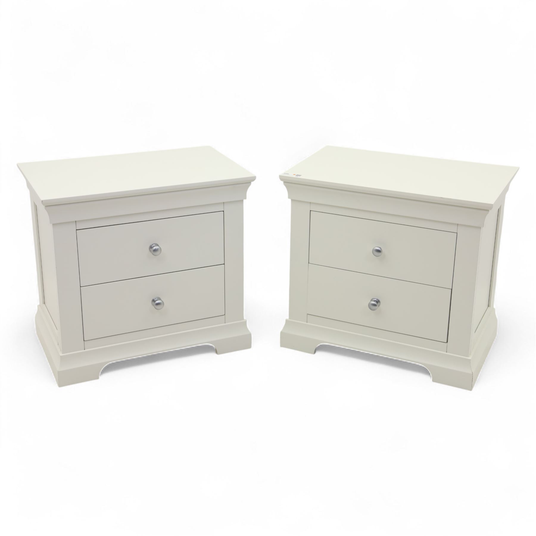 Coxwold Company - pair of white painted jumbo bedside cabinets, with two deep drawers and chrome knob handles,  shaped apron base
