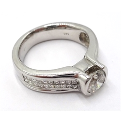  White gold diamond ring with diamond shoulders, tension set central diamond 0.65 carat stamped 14K, with International Gemological Laboratories certificate   