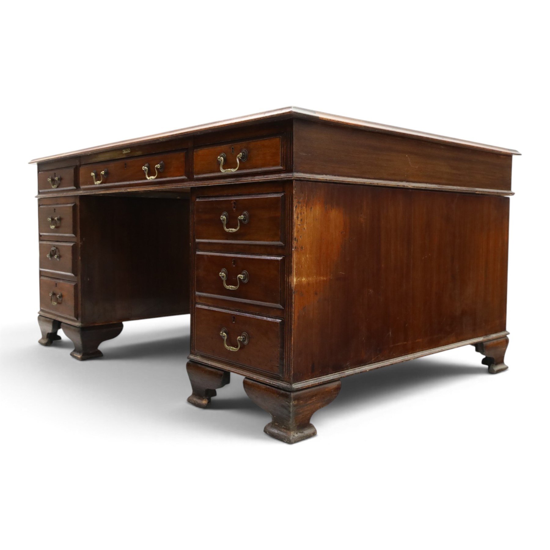 D Matthews & Son Office Furnishers (Liverpool) - Edwardian mahogany twin pedestal partners desk, rectangular top with inset green leather writing surface, fitted with an assortment of twelve drawers with brass swan neck handles, the pedestals with cupboards fitted to the opposing side, raised on ogee bracket feet