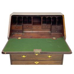 Georgian red walnut and mahogany bureau, moulded rectangular fall front with rounded upper corners, the interior fitted with sliding storage well, a combination of small drawers and pigeons holes, two short and two long drawers below, on bracket feet