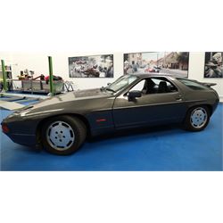 1991 Porsche 928 S4 Automatic Coupé

Registration: L644 LBE
Date of first registration as shown on V5: 1 July 1994
Porsche year of manufacture: 1991
Engine: 5.0-litre V8 petrol
Transmission: Automatic
Odometer reading: 37,886 kilometres (approximately 23,541 miles)
Colour: Slate Grey metallic
Interior: Black leather
V5C: Present
Keys: One
Chassis number: WP0ZZZ92ZMS800460

An exceptional Porsche 928 S4 Automatic Coupé finished in Slate Grey metallic with a black leather interior. The car displays a notably low odometer reading of just 37,886 kilometres, equivalent to approximately 23,541 miles.

The 928 S4 combined Porsche’s powerful 5.0-litre V8 engine with a sophisticated rear-mounted transaxle, creating a refined and accomplished grand tourer. This example is equipped with automatic transmission, electrically adjustable front seats, air conditioning, alloy wheels and the characteristic rear spoiler.

The car was purchased from Specialist Cars of Malton in June 2019, at which time the recorded mileage was 36,650 kilometres. The accompanying service record includes evidence of a cam belt replacement.

Presented in excellent condition throughout, the bodywork and metallic paint finish appear particularly well preserved, while the cabin retains its original character with black leather upholstery and 928-branded sill trims. A Japanese Porsche service label records maintenance entries at 31,902, 33,397 and 34,134 kilometres.

The car also features a Porsche Classic Communications Management (PCCM) upgrade system.

Features

• 5.0-litre V8 petrol engine
• Automatic transmission
• Slate Grey metallic paintwork
• Black leather interior
• Electrically adjustable front seats
• Air conditioning
• Porsche alloy wheels
• Rear spoiler
• Right-hand drive
• Odometer reading of 37,886 kilometres, approximately 23,541 miles
• Purchased from Specialist Cars of Malton in June 2019
• Recorded at 36,650 kilometres when purchased
• Service record showing cam belt replacement
• Japanese Porsche service label
• V5C present
• One key

This vehicle forms part of the Estate of the Late John Sils and is offered for sale by the Executors, confirming a genuine reason for sale.