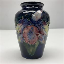 Moorcroft Clematis pattern upon cobalt blue ground miniature globular vase, together with Moorcroft Iris pattern upon a cobalt blue ground miniature vase, largest H9cm