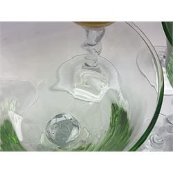 Ten coloured Adriana wine glasses by Abigails, to include blue, green, pink and yellow examples, each with part faceted bowl and twist stems, together with two similar orange examples with pulled stems, H24cm