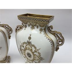 Pair of Copelands enamel jeweled twin handle vases, each decorated with a seated female figures, makers mark beneath, H22cm