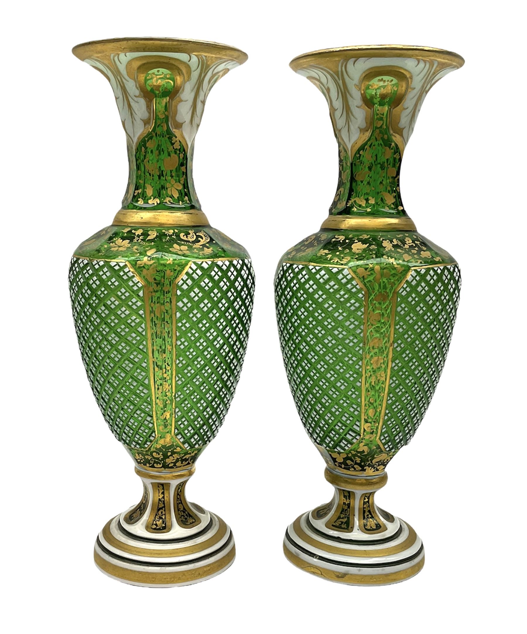 Pair of Bohemian green glass vases, overlaid in white with leaf panels ...