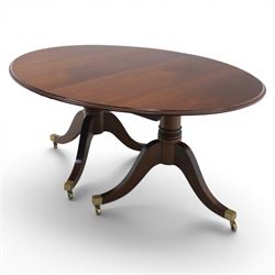 Gott's Pickering - Quality Georgian design rosewood twin pillar extending dining table, with additional leaf, oval form raised on turned columns with tripod legs on cast brass sockets and castors, complete with brass coupling forks, length 164cm without leaf