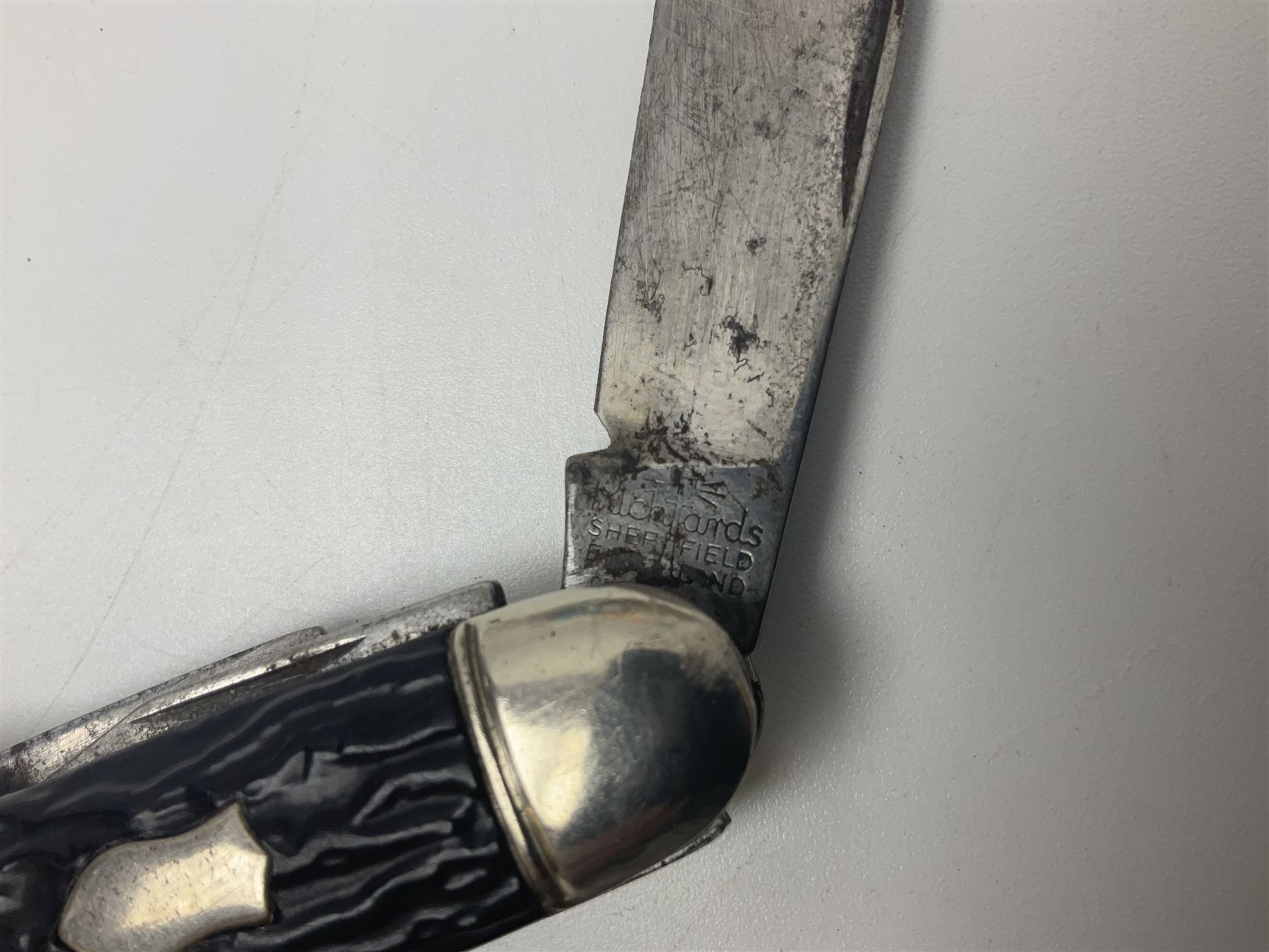 Seven pen knives, two lighters, including one Ronson example and a collection of postcards