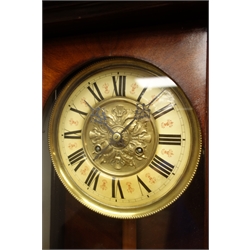  Late Victorian walnut cased Vienna type wall clock, cresting with turned finials, glaed door with fish-scale columns, circular dial with twin train movement striking the half hours on a coil, H115cm   