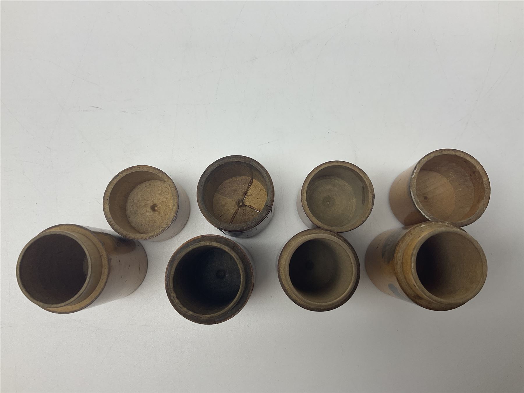 Collection of Mauchline ware relating to sewing, to include four ovoid shaped thimble cases, hinged lid thimble case and needle cases (12) 