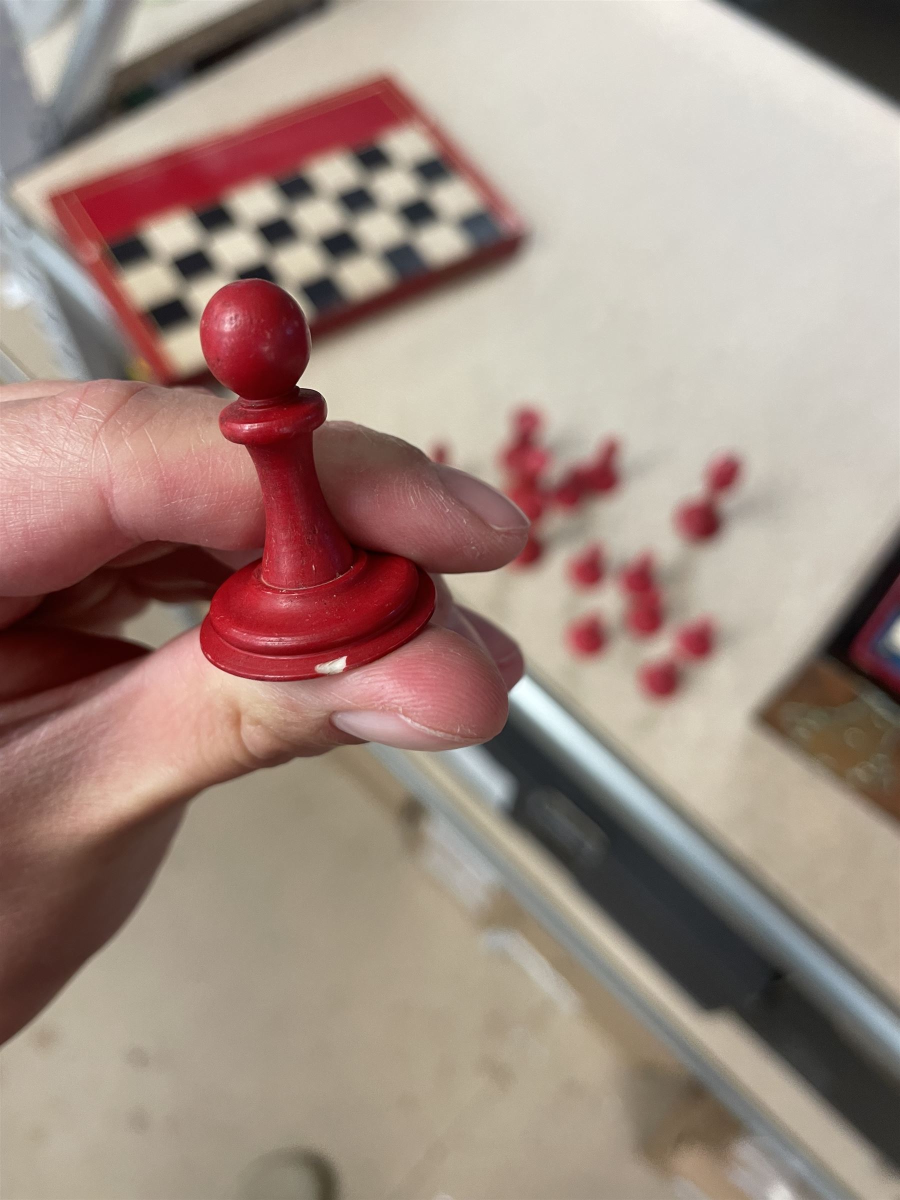 19th century walnut and brass bound games compendium box, painted to enhance the grain, of rectangular form, the hinged opening cover with rounded sides, central brass cartouche with engraved lion crest, and brass riveted straps, opening to reveal a red leather and blue silk lined compartmented interior, with fold-down games board, and lift-out tray containing playing cards, ebony turned dice towers, white and red stained bone draughts, and chess pieces, ivory dice, and ivory and ebony whist markers, and brass bezique board, cribbage board and markers, H15cm W32cm D24cm
This lot has been registered for sale under Section 10 of the APHA Ivory Act