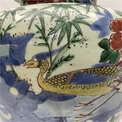 19th century Chinese Wucai vase and cover, decorated  with peacock on blue rockwork and other birds flying amongst tree peonies, H43cm