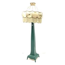 Arts & Crafts style green painted standard lamp, curved and tapered form on platform with splayed bracket feet and shaped aprons, with bulbous shaped shade, H151cm (height excluding shade and fitting)