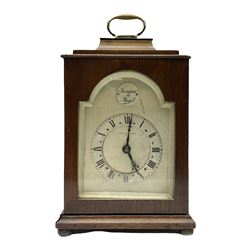 Georgian style mahogany cased bracket type clock retailed by Henry Lee & Sons Hull, with brass carrying handle to the pagoda top, arched silvered dial with Tempus Fugit plaque, raised chapter ring with Roman numerals enclosing French brass eight day movement with integral key, on bun feet, H24cm  