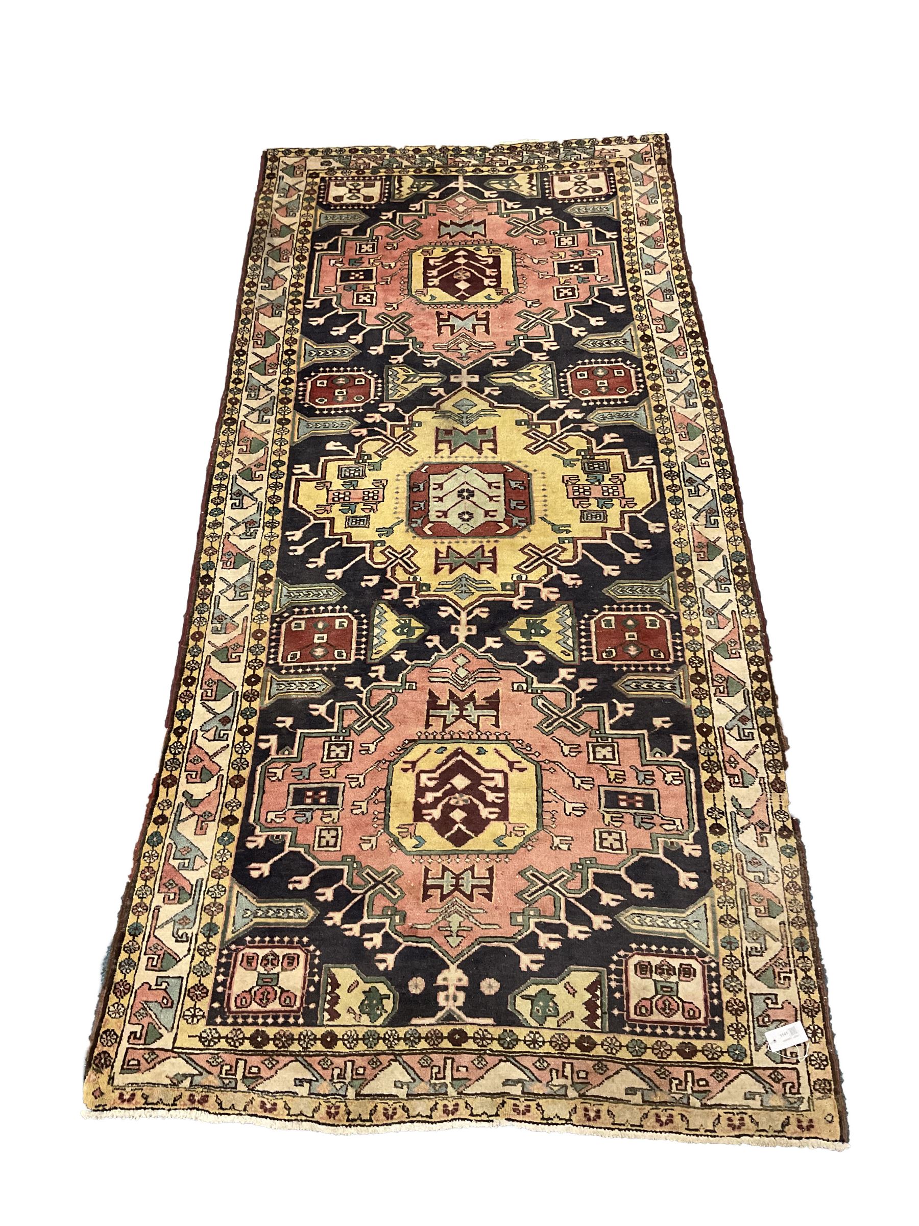 Turkish design blue and beige ground rug, triple medallion, repeating border
