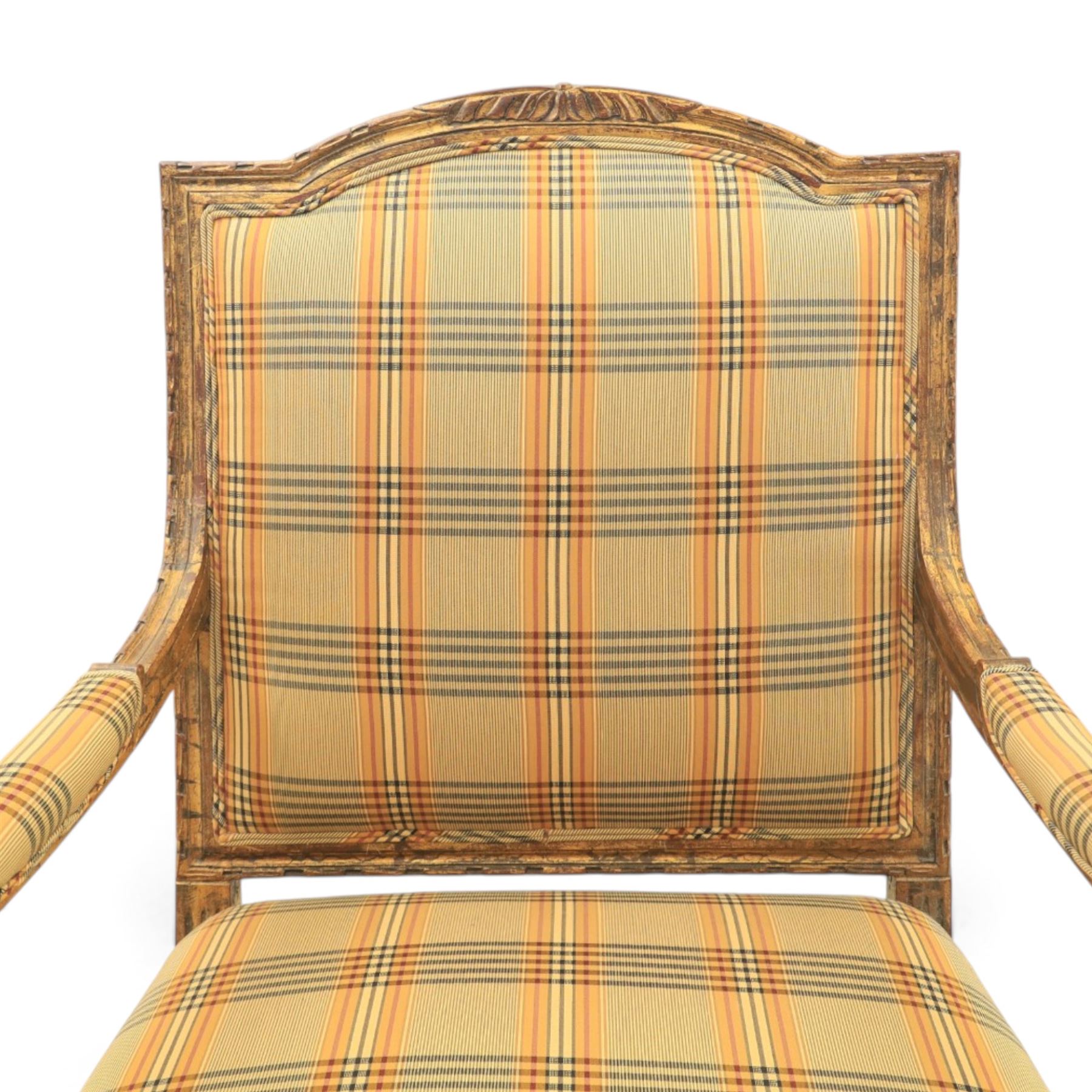 Louis XVI style painted fauteuil, the shaped padded back and overstuffed seat upholstered in cream tartan fabric, with scrolling open arms on fluted supports, the moulded frame with carved ribbon twist, rosette and husk decoration, raised on turned and fluted tapering legs