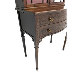 Edwardian mahogany tall and narrow display cabinet with scroll pierced broken arch pediment over two astragal glazed doors on serpentine stand with two blind-fret carved drawers and four square tapering legs with spade feet