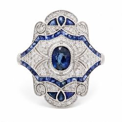Platinum sapphire and diamond dress ring, milgrain set with a single oval cut sapphire, su...