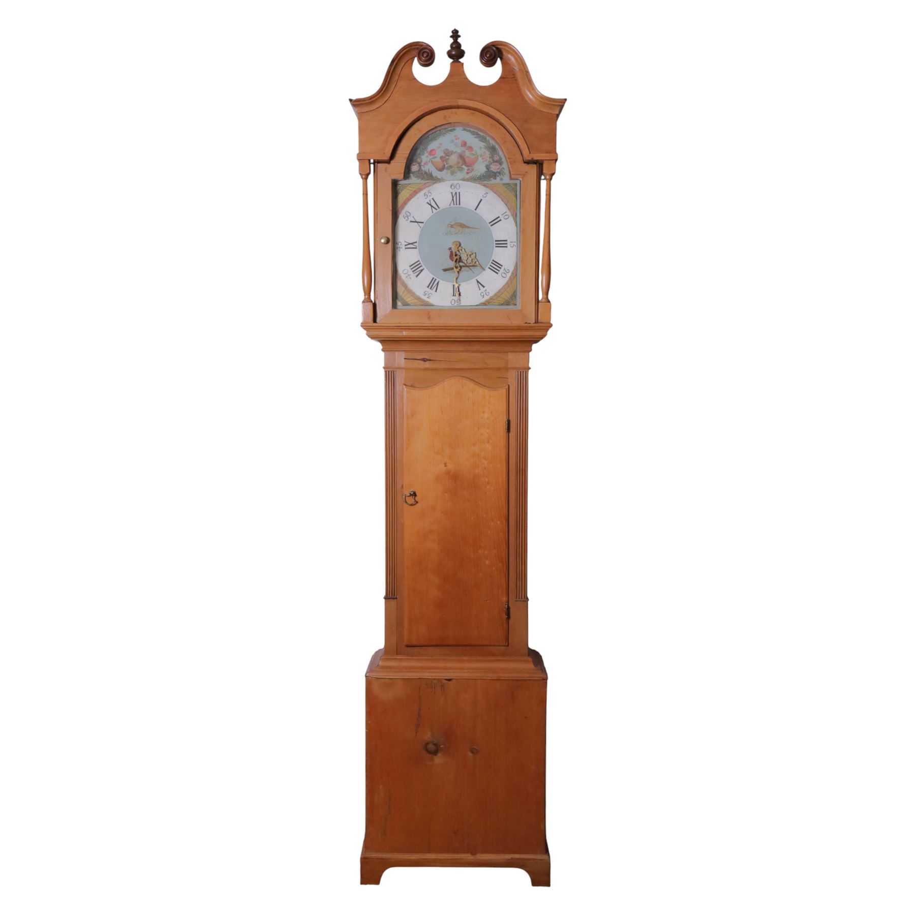 30-hour, 19th-century provincial pine weight-driven longcase clock, with a swan neck pediment, arched hood door with shaped columns with a long door with a shaped top on a square plinth with a shaped base, painted arched dial decorated with fruit and birds and patera decorated spandrels, brass hands, Roman numerals and minute track, dial pined to a chain driven countwheel striking movement, striking the hours on a bell, with a pendulum, back feet missing