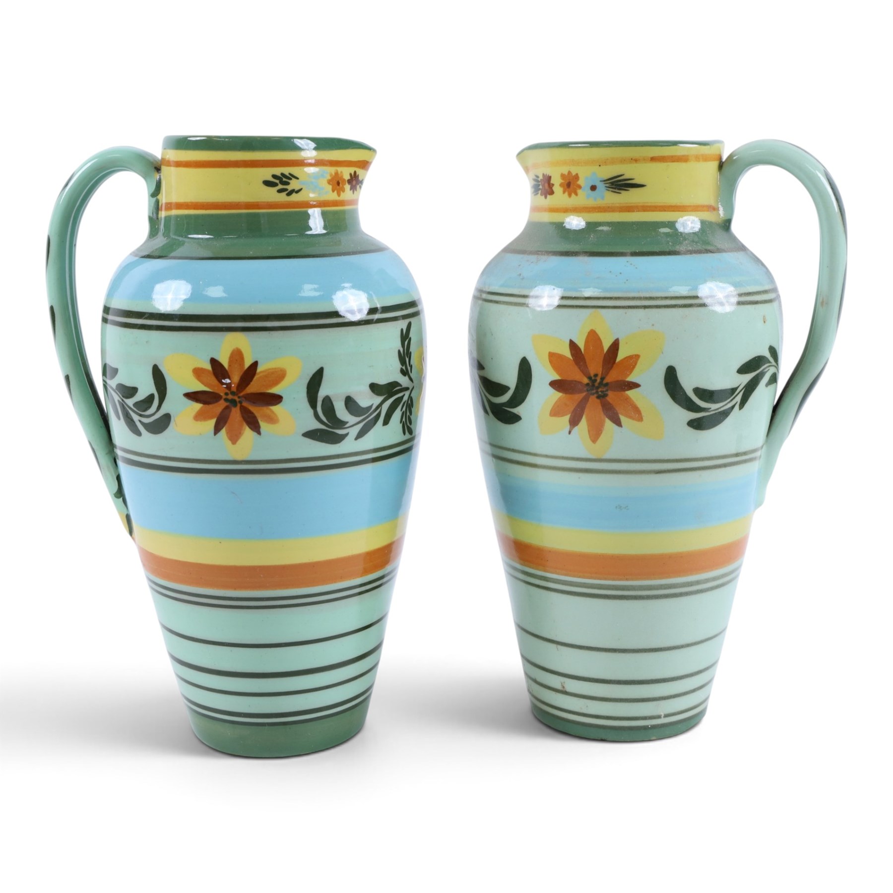 Hartrox Stoneware, comprising five jugs and two bowls, all with green, blue, yellow and oragne floral and abrstact decoration, with printed marks beneath, tallest H26cm