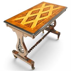 Victorian walnut marquetry and parquetry centre table, the rectangular top with floral marquetry and geometric lattice parquetry with ebonised moulded edge, raised on lyre-shaped end supports with pierced floral scrollwork, united by a spiral-turned stretcher, on brass castors