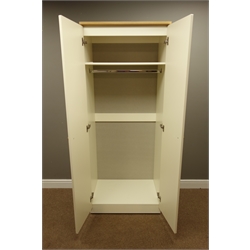  Cream and oak finish two door wardrobe with shelf and hanging space to interior, W74cm, H184cm, D53cm  