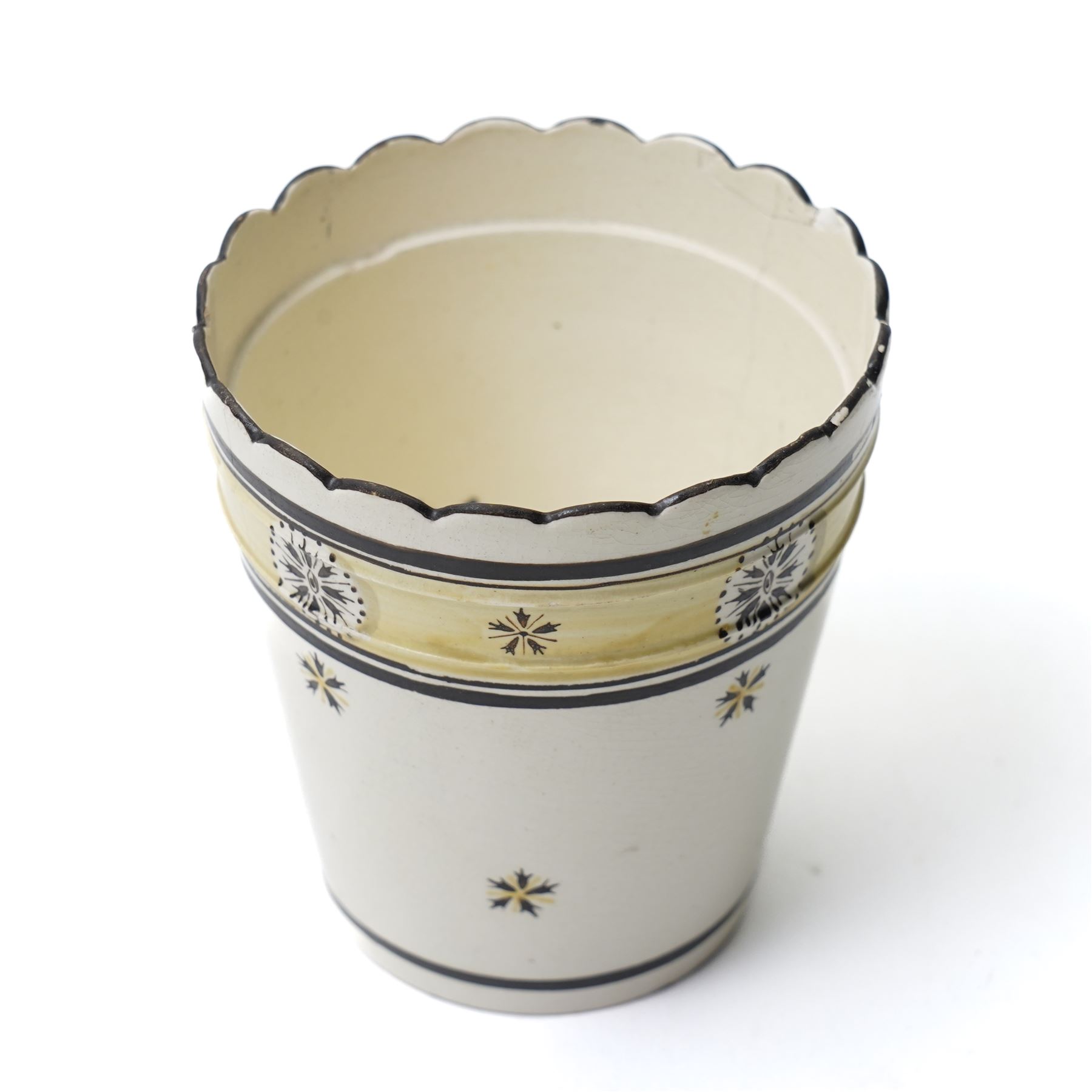 Russian, probably Gardner figure of a man pushing a wheelbarrow on gilt lined rectangular base, impressed mark, H16cm, 18th century creamware beaker with star shape decoration, 18rh century Worcester cup with panels of flowers on a blue ground and a French shell shape scent flask (4)