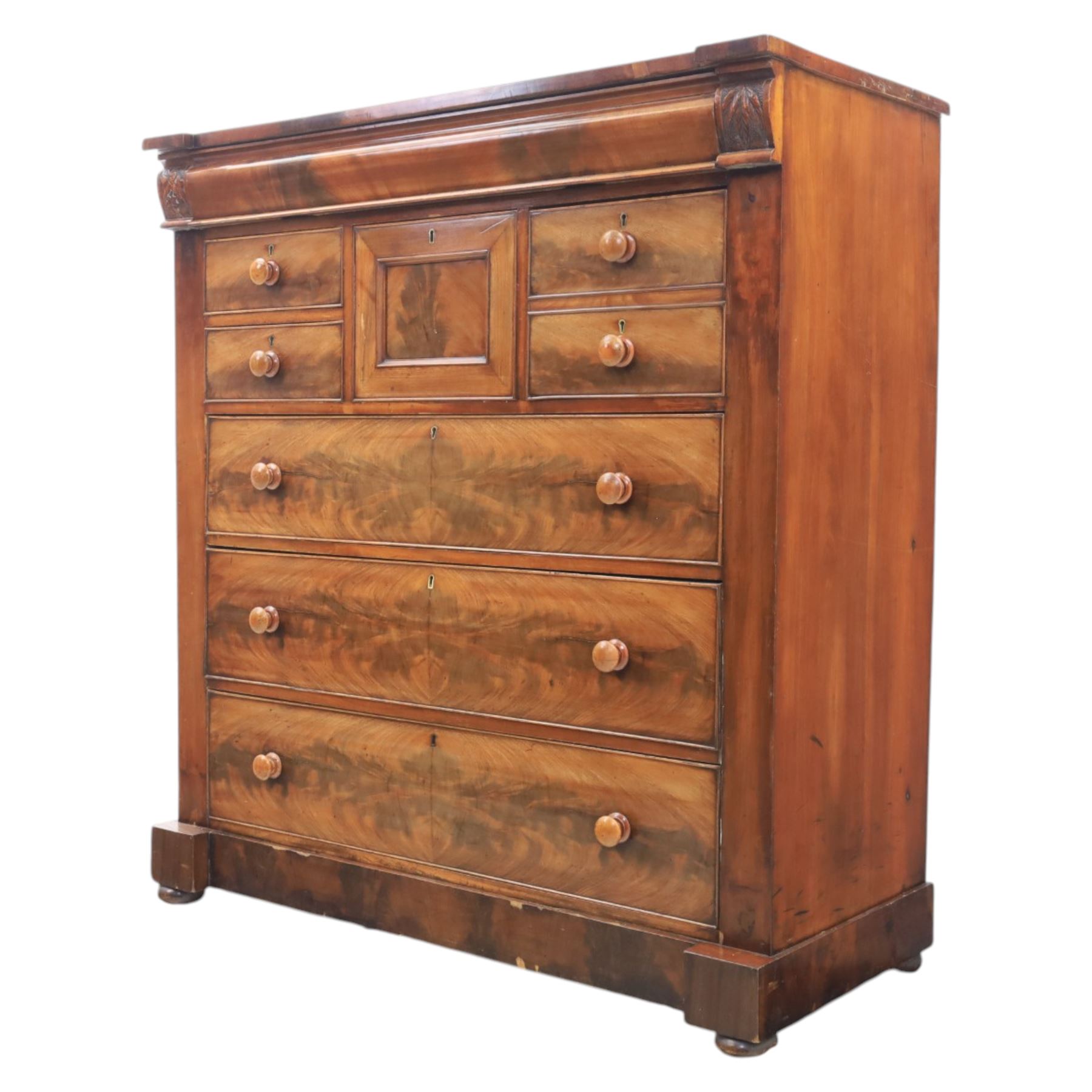 Victorian Scottish mahogany chest, cushion drawer over assorted small drawers and three long drawers, all with flame veneered fronts, turned wooden handles