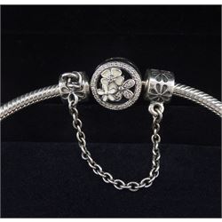 Pandora Moments flower clasp silver bracelet with Disney Cinderella charm, seven other Pandora charms, and flower safety chain, boxed