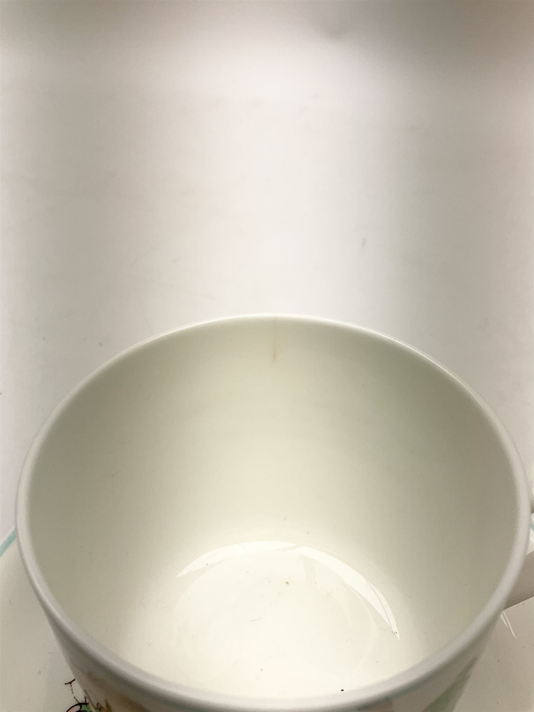 Shelley Boo Boo three piece tea set designed by Mabel Lucie Attwell, comprising teapot modelled as a house, sugar bowl modelled as a toadstool, and creamer modelled as an elf, each with printed marks beneath, together with a Shelley Mabel Lucie Attwell teacup and saucer. 